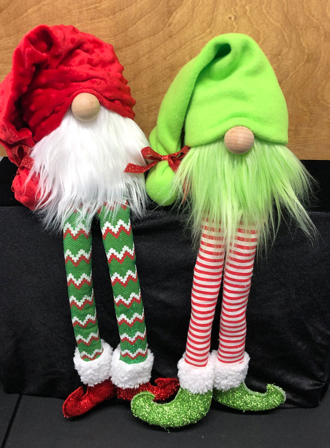 hand crafted funny christmas gnomes with long legs and elf shoes.