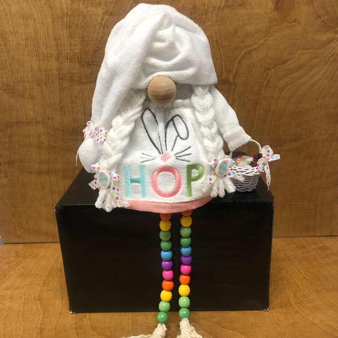 hand crafted Easter gnome, with beaded legs, mini basket with chocolate bunny and embroidered dress.