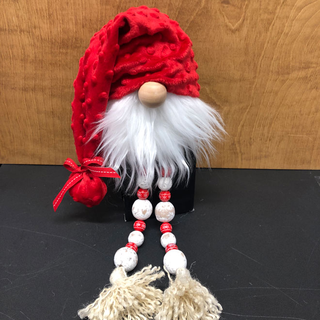 hand crafted red and white gnome with beaded legs, farmhouse style