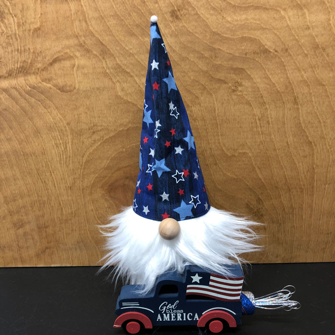 hand crafted patriotic gnome with a truck, flag and streamers