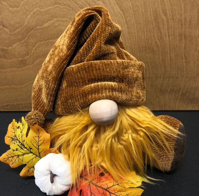 hand crafted plush autumn gnome in rusty brown colors.