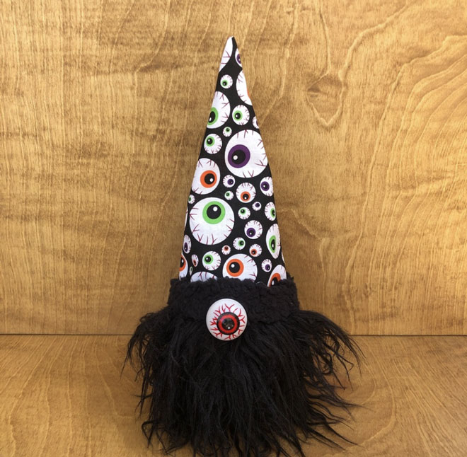 hand crafted fun spooky halloween gnome with an eyeball nose